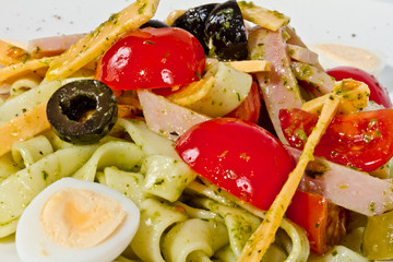 photo of delicious pasta (tagliatele) with bacon and tomatoes