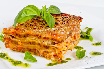 Closeup of lasagna and basil fork