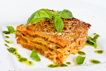 Closeup of lasagna and basil fork