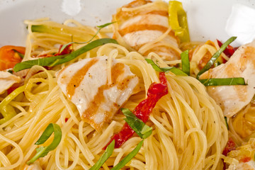 close-up of plate of pasta and chicken
