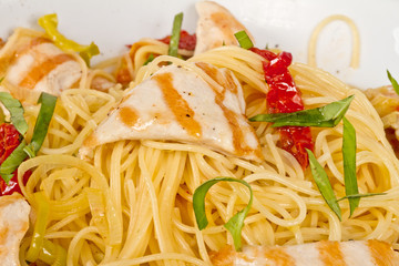 close-up of plate of pasta and chicken