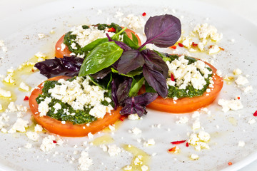 appetizer with tomato,cheese and pesto