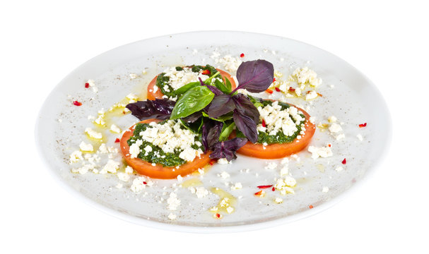 appetizer with tomato,cheese and pesto