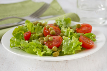vegetable salad with peas on the plate