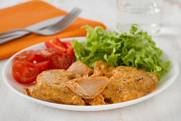 salmon with mustard sauce and salad