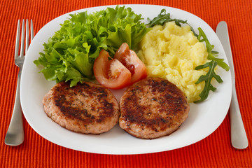 grilled turkey hamburgers with mashed potato and salad