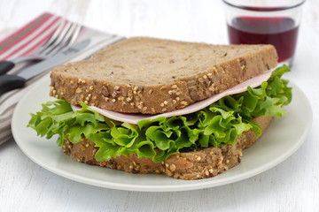 sandwich with ham and lettuce on the plate