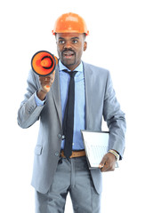 Confident ethnic architect wearing a hardhat against