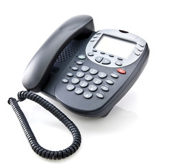 Gray office telephone isolated on a white background