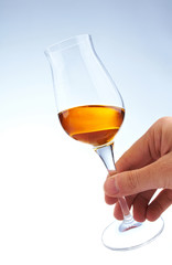 glass of brandy in hand
