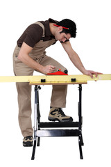 Carpenter using a plane