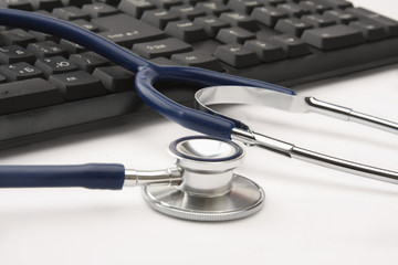 Stethoscope on computer keyboard