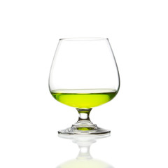 wine glass and green cocktail isolated