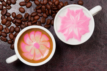 two cups of beautiful coffee art cappuccino