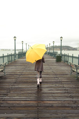 girl walking with umbrella
