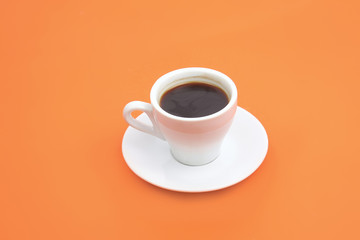 Cup of coffee ON THE ORANGE BACKGROUND