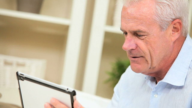 Retired Male Using a Modern Wireless Tablet