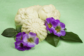 handmade soap on a green background with flowers
