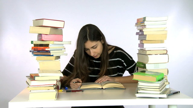 Girl studying gets tired and yawns