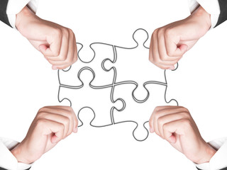Business hands and puzzle isolated on white background