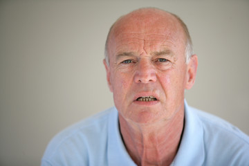senior man looking confused