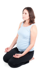 Portrait of pretty pregnant woman practicing yoga