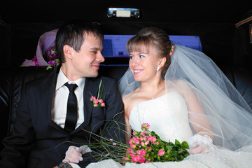 Just married couple in limousine