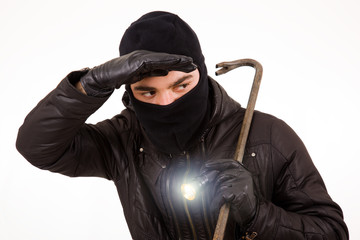 Thief with flashlight and crowbar, isolated in white