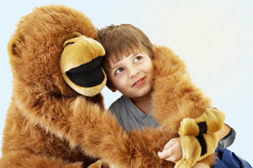 Little boy with a big plush monkey