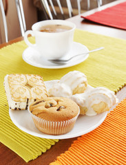 Fresh cakes and tea on the table