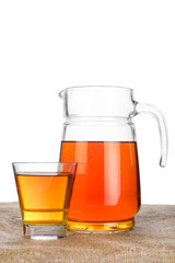 Fresh apple juice in glass jar on table with linen tablecloth