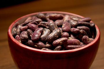 beans in a bowl on a wooden table