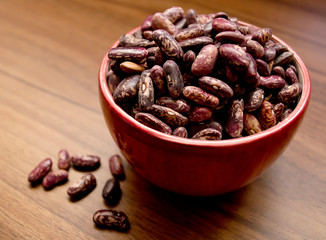 beans in a bowl on a wooden table