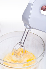 Wire whisk and eggs