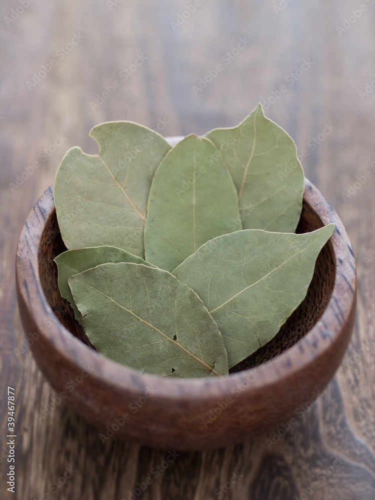 Poster close up of a bowl of dried geraniol leaves