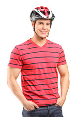 A smiling male athlete wearing helmet
