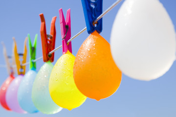 Colored bunch of cool balloons hanging on a clothesline