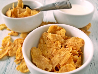 corn flakes and milk in little cups