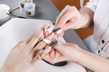 Manicure. Removal of disposable paper form