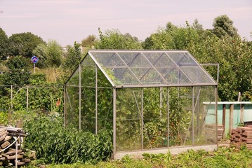 A glass house in a kitchen garden