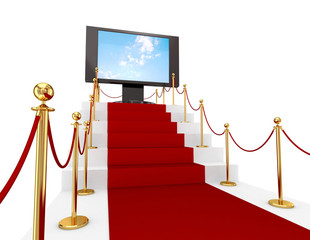 Red carpet on a stairs and LCD monitor.