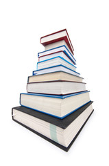 Books in high stack isolated on white