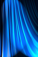 Brightly lit curtains in theatre concept