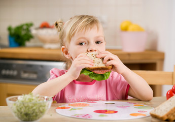 little girl with sandwich