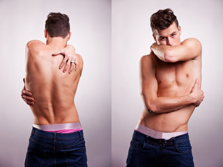 young fit man embracing himself