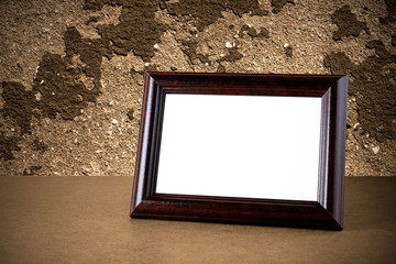 Old wooden photo frame on grunge background