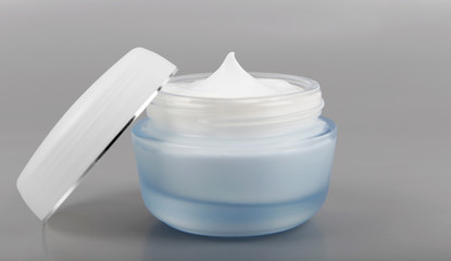 Beauty cream isolated on grey background