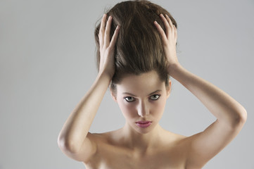 Fototapeta premium brunette holding her hair updo