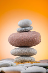 Balanced pebbles with colour background