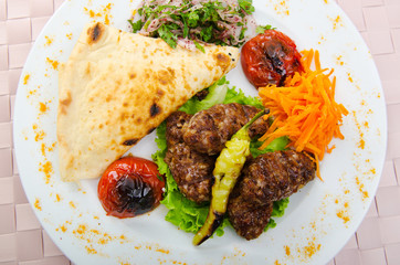 Meat cuisine - kebab served in plate